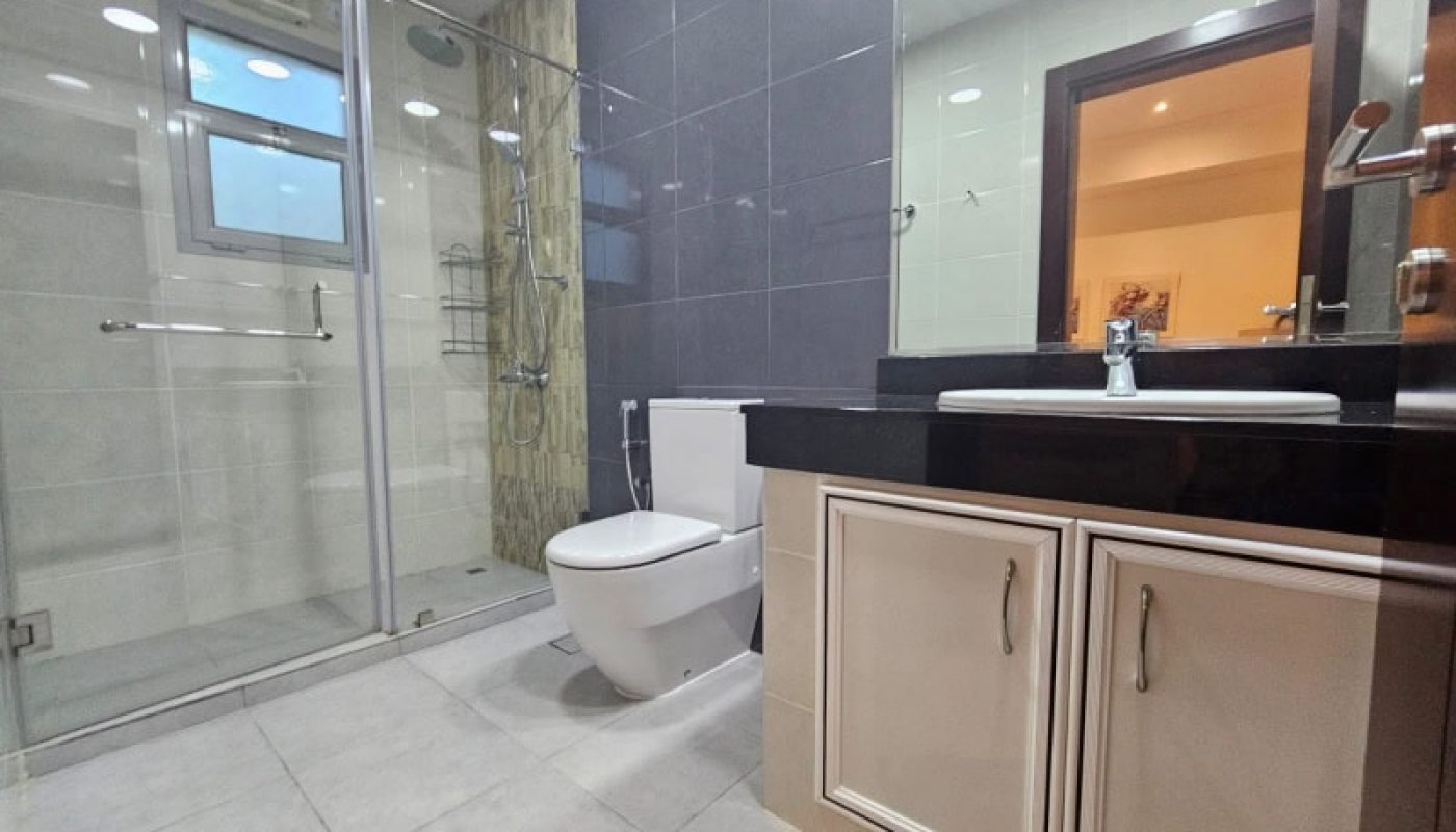 Modern bathroom with a glass shower enclosure, toilet, and Auto Draft vanity with a large mirror.