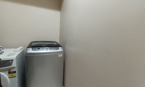 A washer and dryer in a small room.