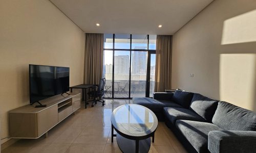 An Auto Draft living room with a couch and a flat screen TV.