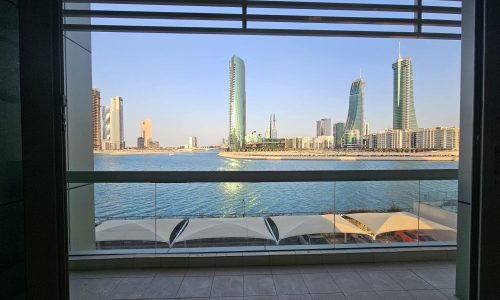 View of a modern city skyline seen from an Auto Draft with waterfront in the foreground.