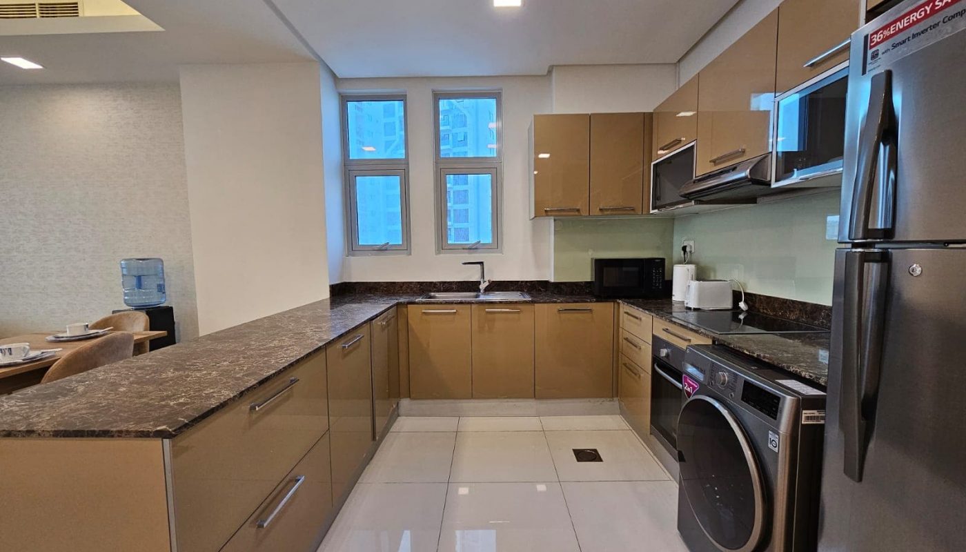 Modern kitchen interior with stainless steel appliances, granite countertops, and an Auto Draft system.