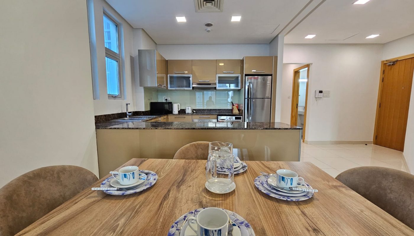 Modern kitchen interior with a dining table set for four and an Auto Draft system.