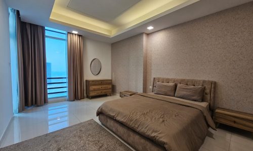 Modern bedroom with a large bed, ambient lighting, and a balcony access. Auto Draft