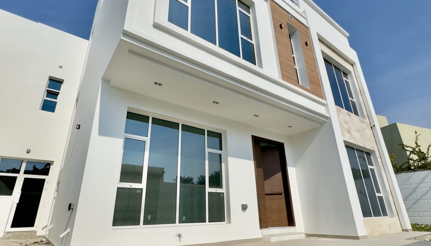 A Saar luxury villa with large windows and balconies.