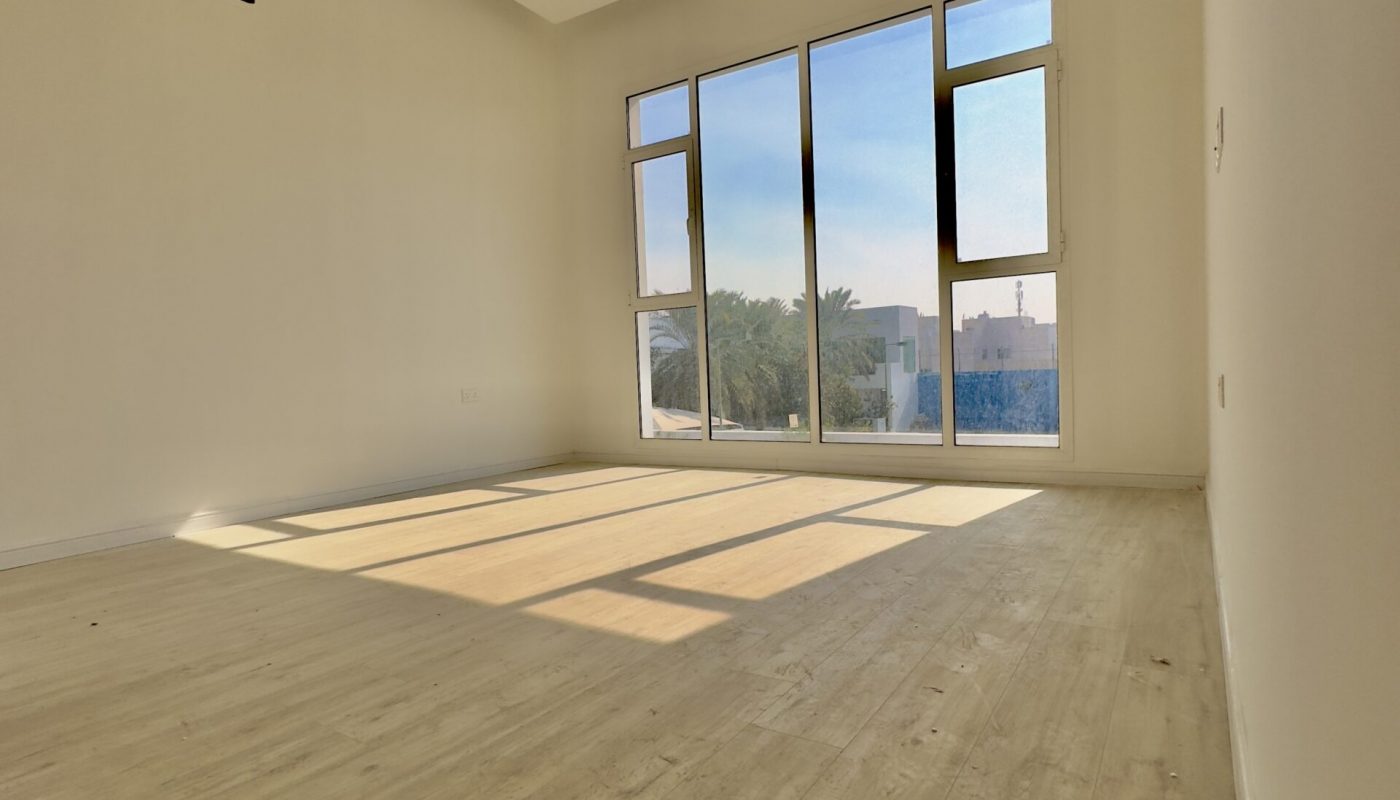 A luxurious room with wooden floors and large windows, located in the Saar Area.