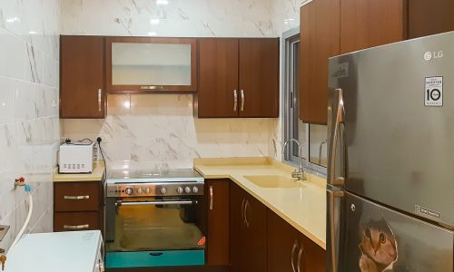 A furnished apartment for rent in Adliya with a 2BR layout and stainless steel appliances.