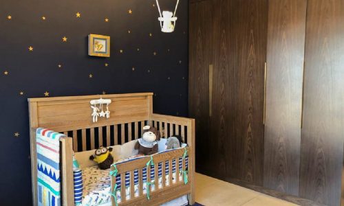 Modern Baby's Room with Blue Walls and Star Decoration.