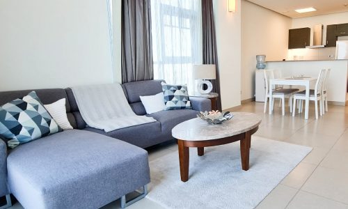 A dazzling living and dining area in a modern 1BR apartment for rent in Reef Island.