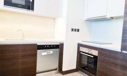 Luxury 1BR Flat for Sale in Seef with kitchen appliances.