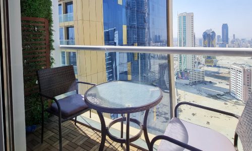 A spacious luxury studio in Seef with a balcony overlooking the city.