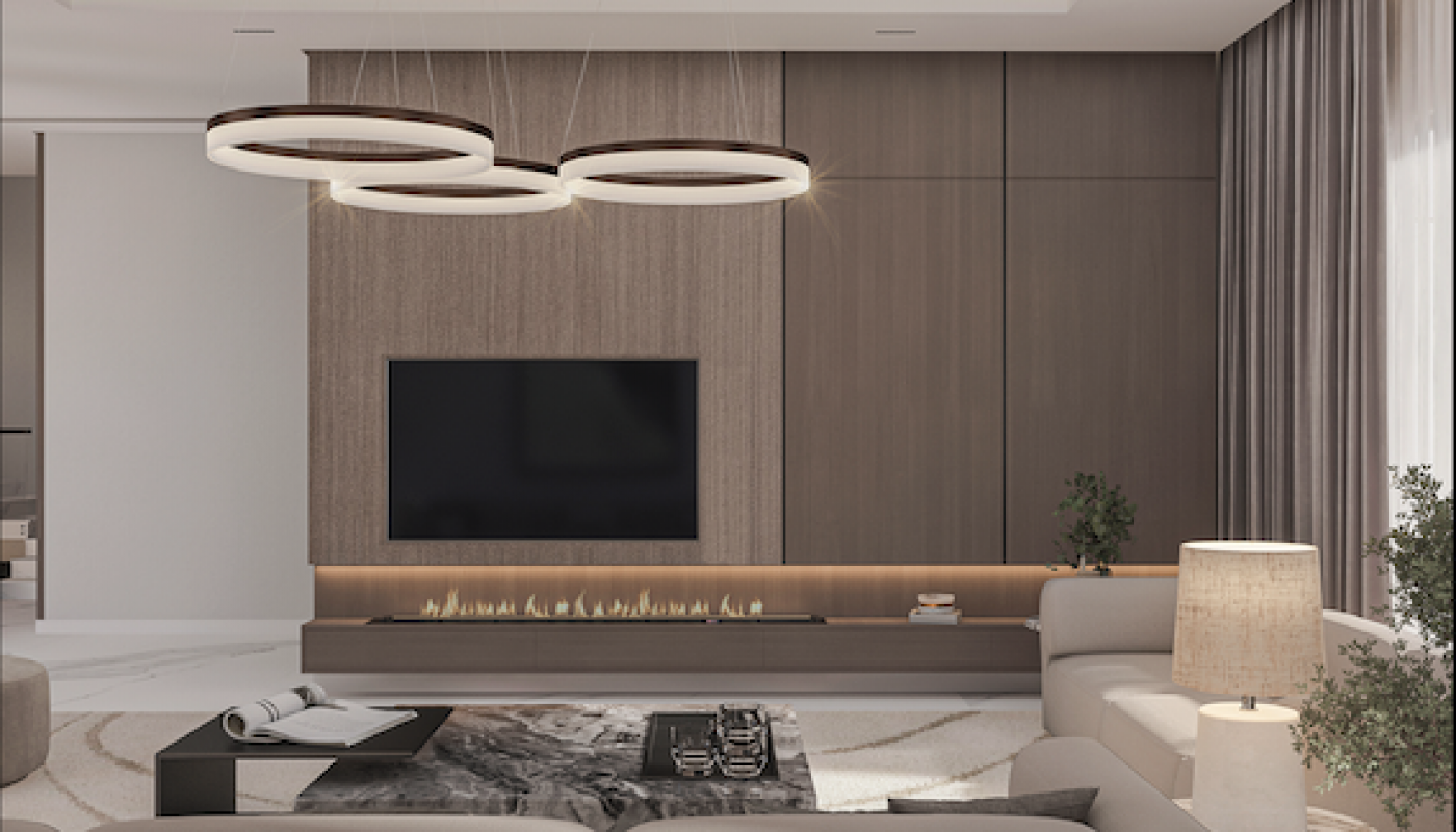 Modern living room with neutral tones, a large wall-mounted TV, circular pendant lights, beige sofas, a low coffee table, and floor-to-ceiling curtains.
