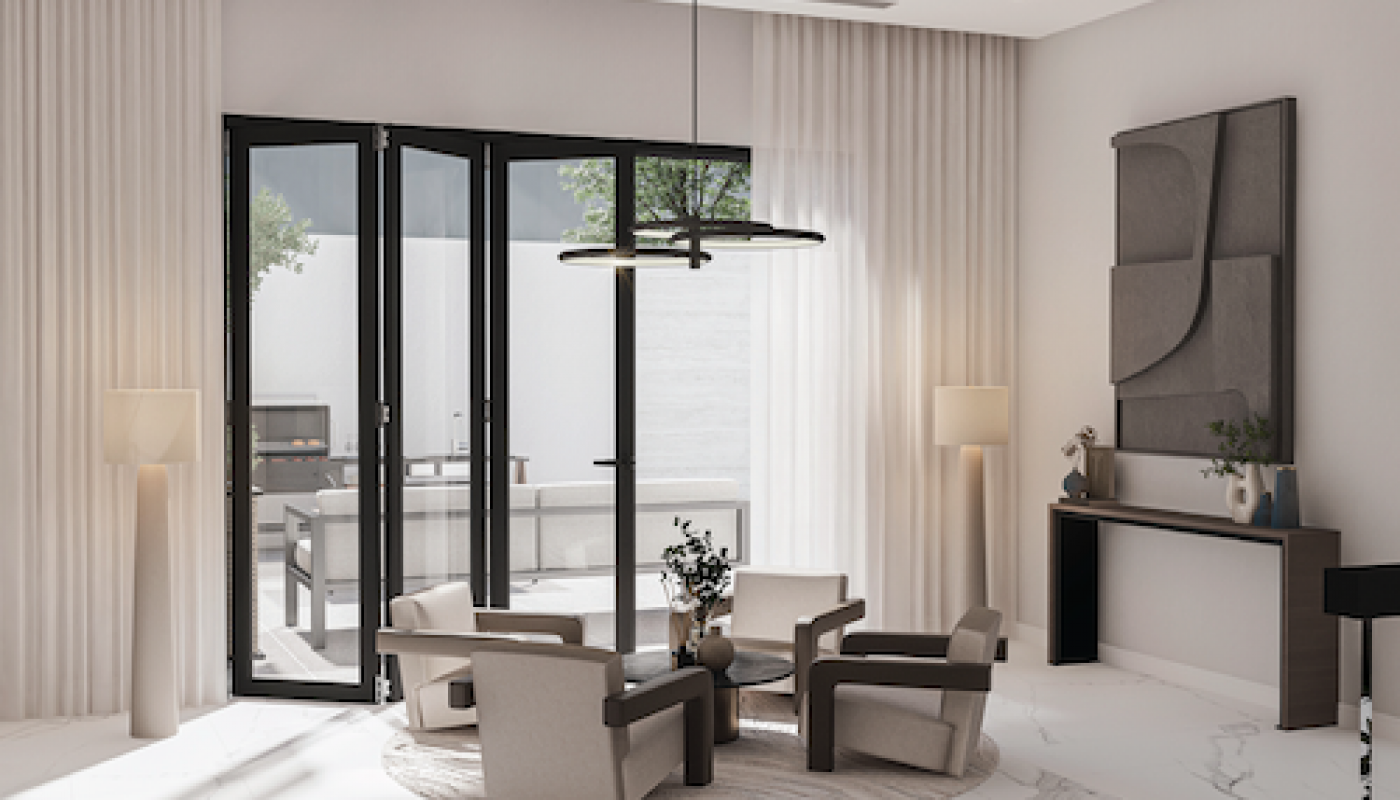 Modern living room with four armchairs around a circular table on a rug, large windows, floor lamps, and minimalist wall art above a console table.