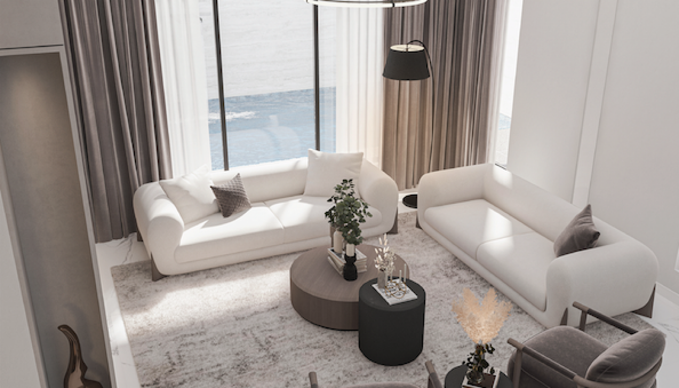 Modern living room with two white sofas, two gray armchairs, round coffee tables, a decorative sculpture, and large windows with sheer curtains. Neutral color palette throughout.
