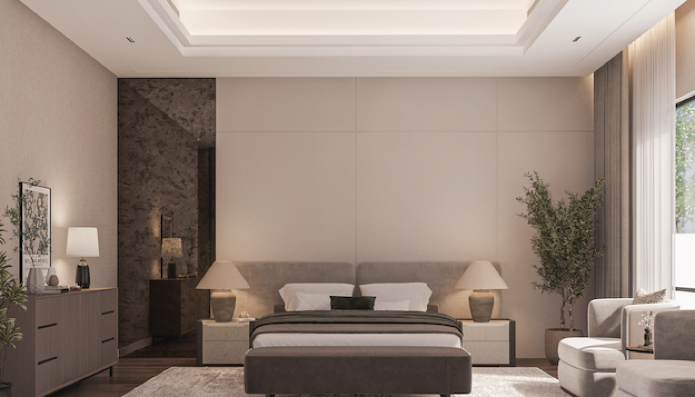 Modern bedroom with a large bed, two nightstands with lamps, a dresser, armchairs, a rug, and a potted plant by a window letting in natural light.