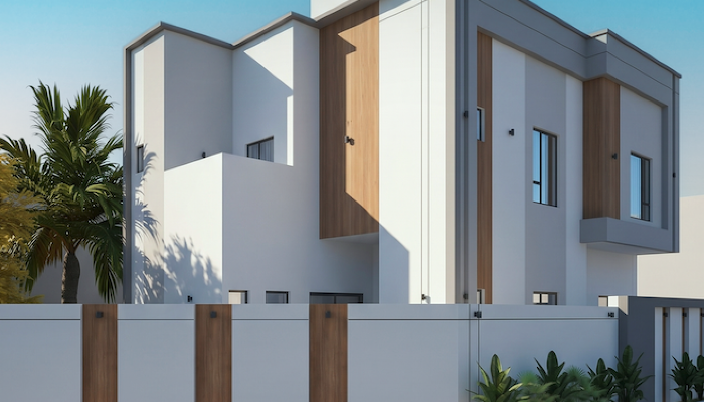 Modern two-story house with a flat roof, white walls, wood accents, and large windows, surrounded by a white fence with wooden panels, and plants along the exterior.