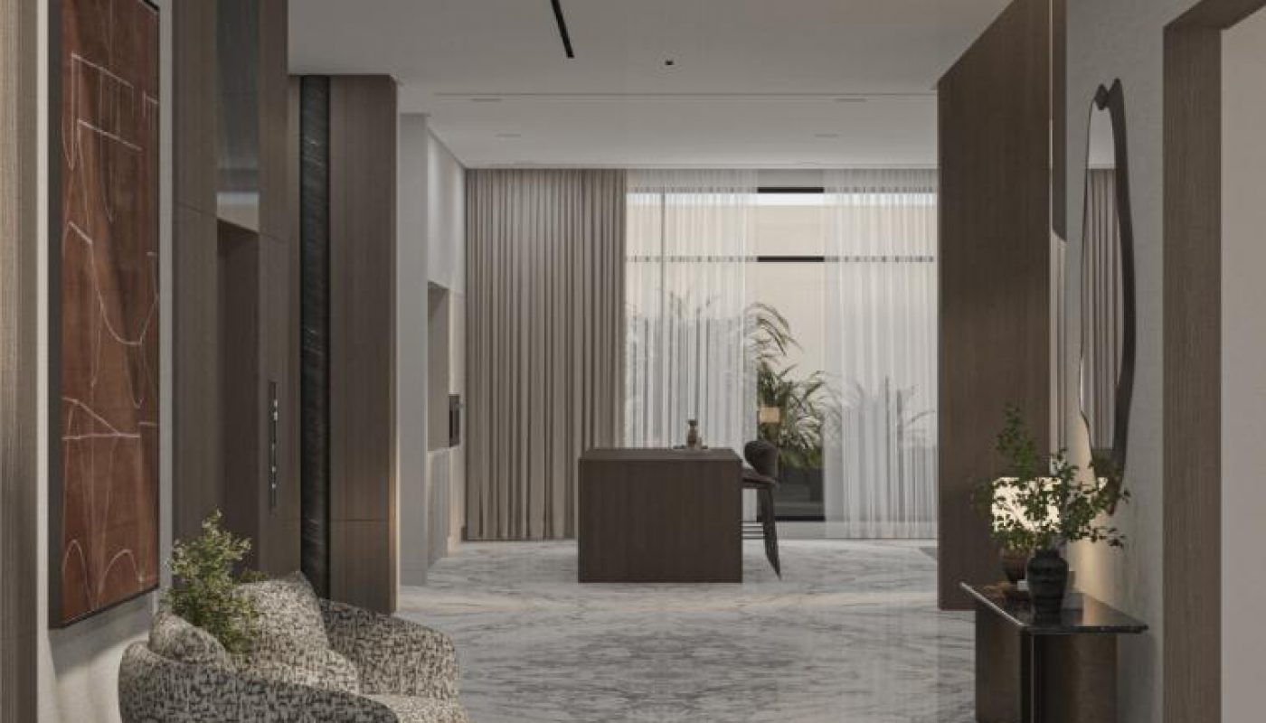 Modern lobby with marble floors, a patterned armchair, wall art, console table with decor, large mirror, and floor-to-ceiling windows with sheer curtains letting in natural light.