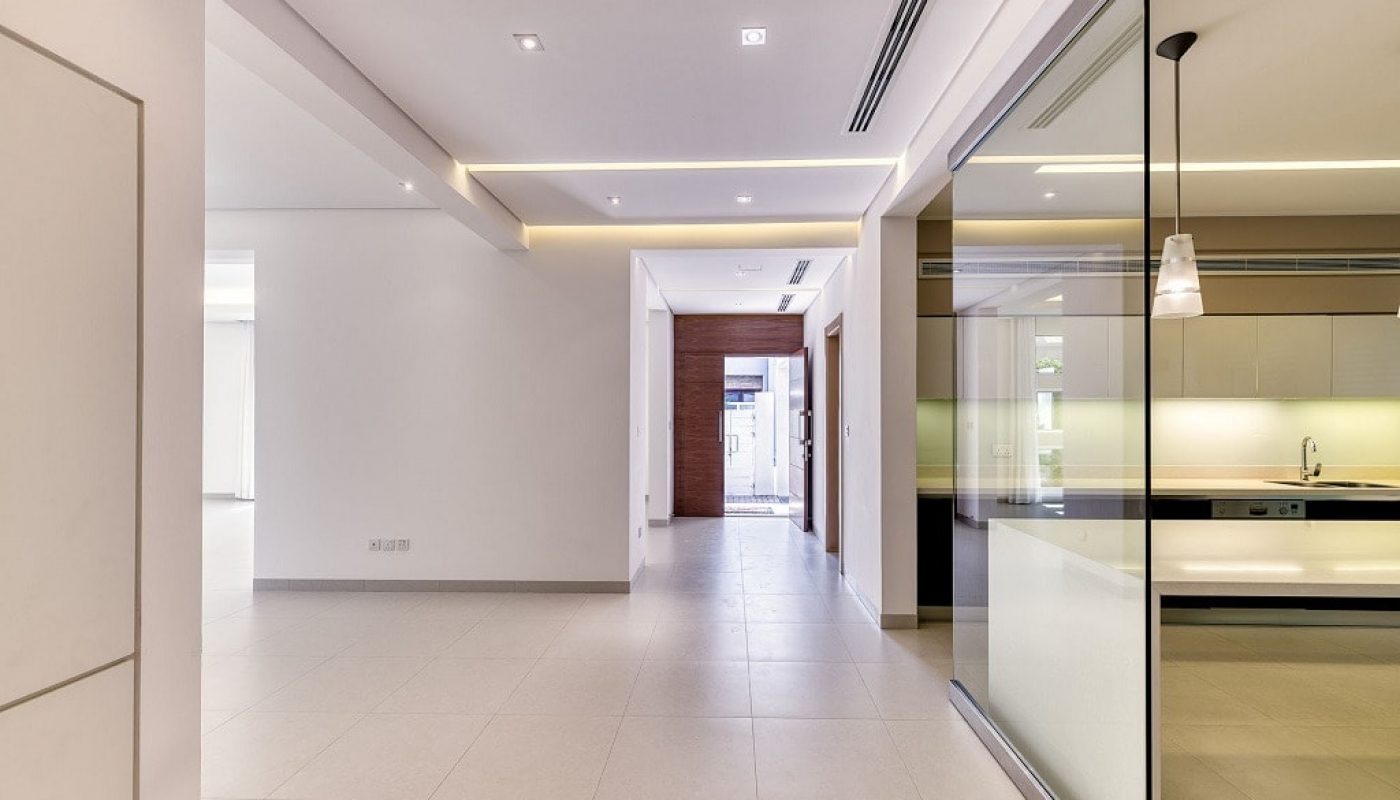 A luxurious villa in the Saar area featuring a stunning hallway with glass doors for sale.