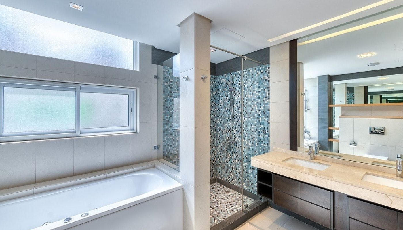 For sale: A luxurious villa in the Saar Area with a bathroom featuring two sinks and a tub.