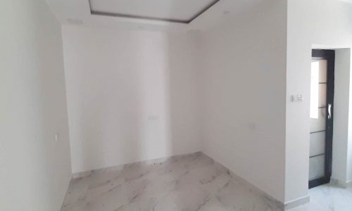 New Innovative room with white walls and marble floors.