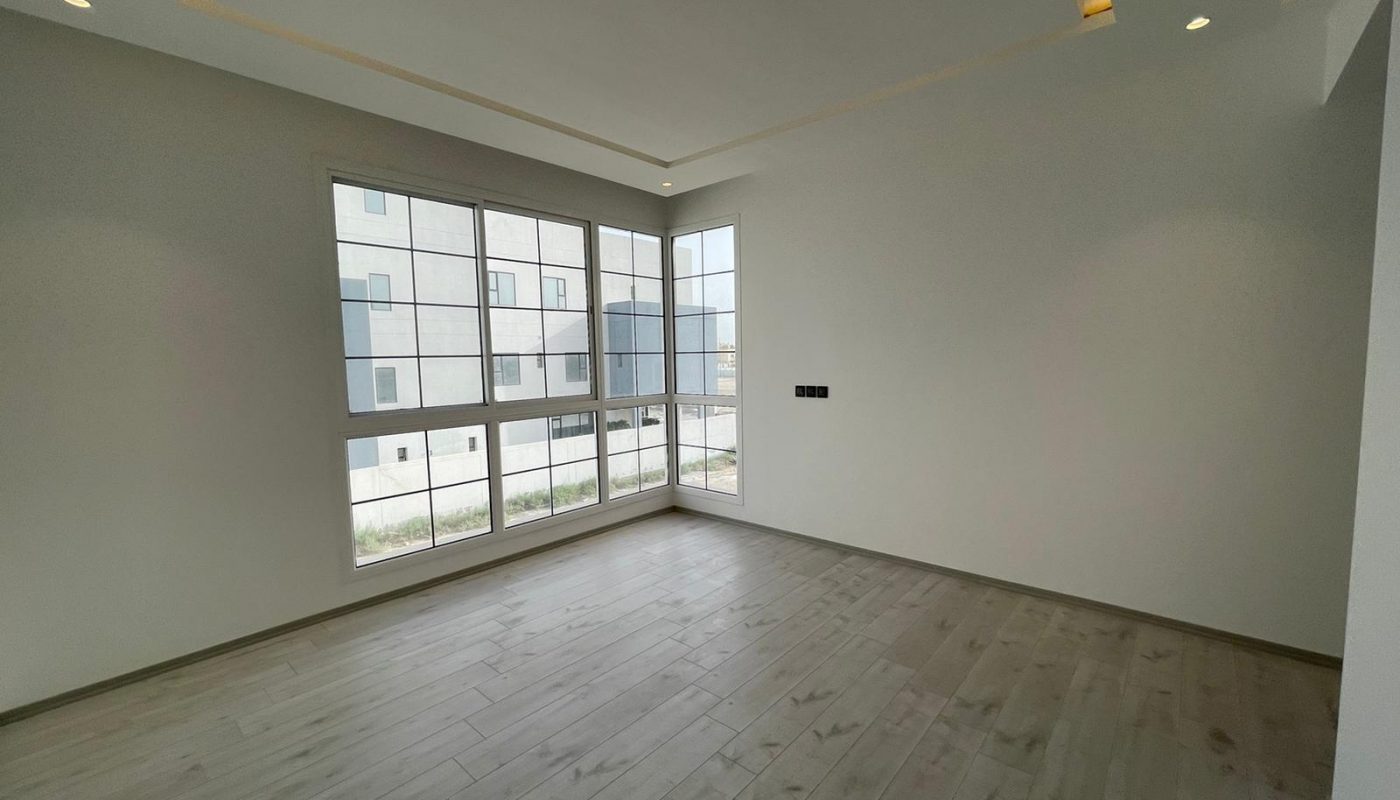 A luxurious villa with wooden floors and a panoramic view of the city.