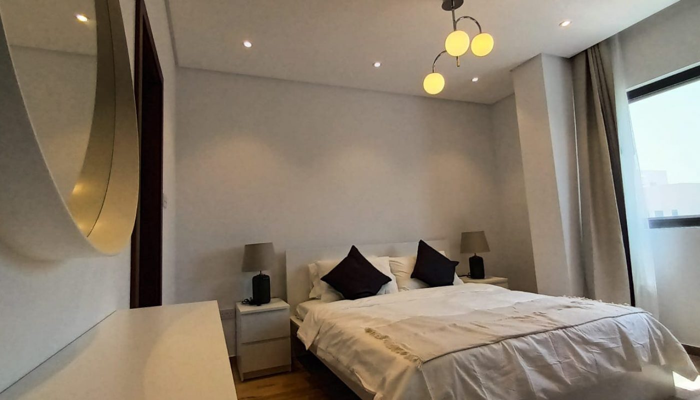 Brand New 3BR Apartment with white walls and bed for Rent in Al Janabiyah.