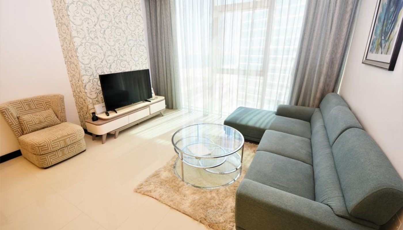 Stunning living room with a couch and tv.