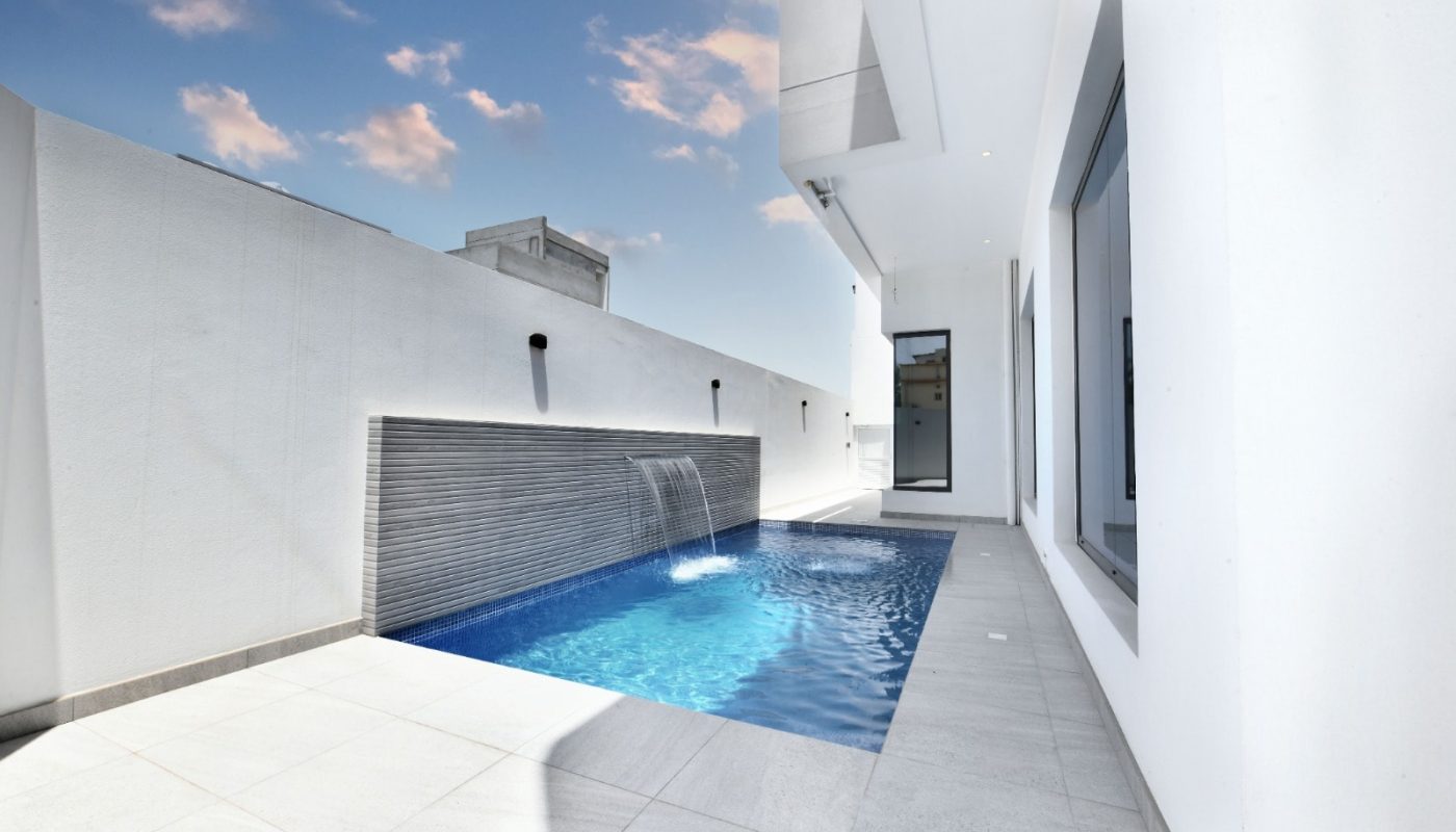 Modern Villa for Sale in Janabiyah with a swimming pool in the backyard.