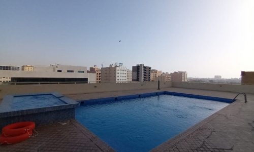 A fully furnished swimming pool located in the heart of a city, ideal for those seeking a Western-oriented lifestyle.