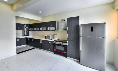 Luxury kitchen with stainless steel appliances.