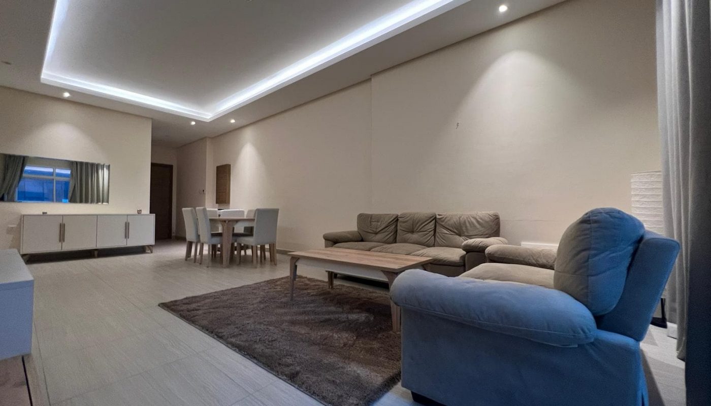 A spacious living room and dining room in a modern apartment available for rent in Juffair.