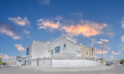 A modern villa for rent in Janabiyah, located in the middle of a street.