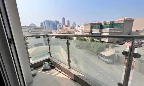 A spacious balcony with a view of the city in Juffair.