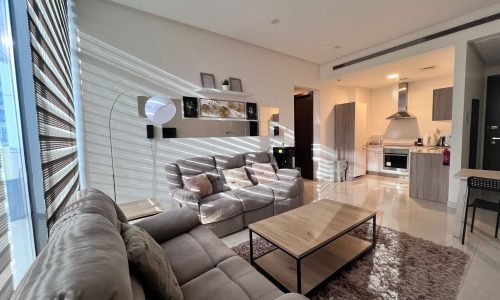 A luxury living room with a couch and a table.