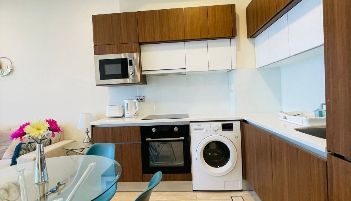 A kitchen with an auto draft washer and dryer in it.