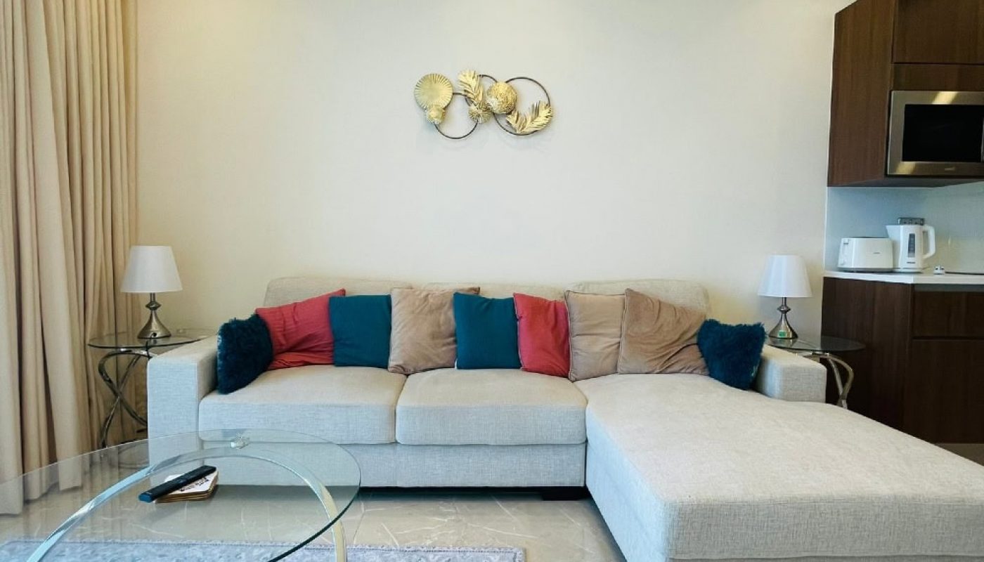 A living room with a couch, coffee table, and Auto Draft.