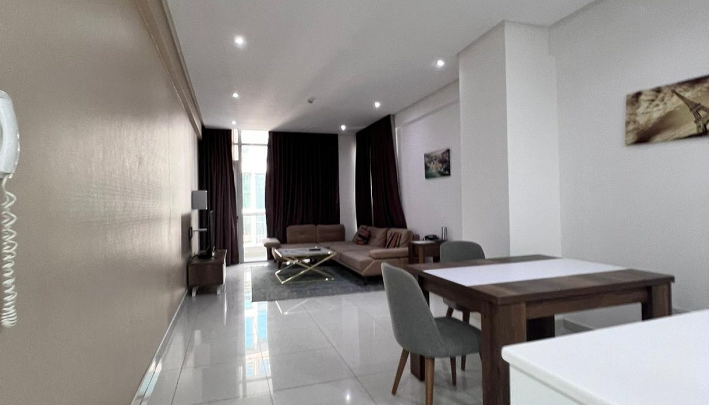 A modern apartment with a luxurious kitchen and dining area.