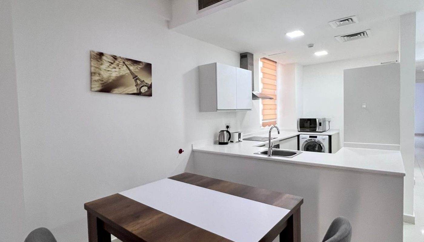 A luxury modern apartment featuring a kitchen and dining area.