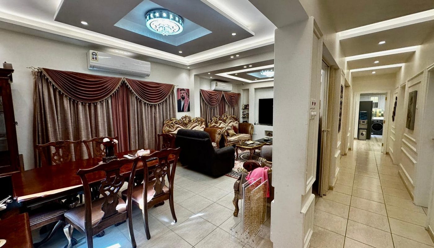 A luxury Private Villa in Janabiyah with a table and chairs.