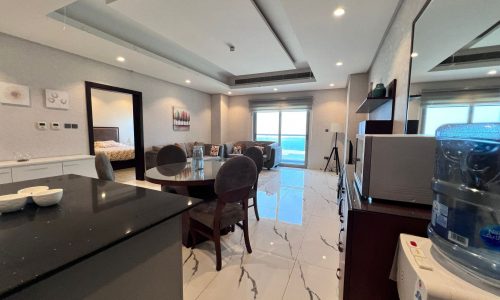 A luxury apartment with a furnished kitchen and dining area in Juffair.