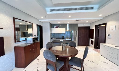 A luxury kitchen and dining area in a furnished flat in Juffair, a modern apartment.