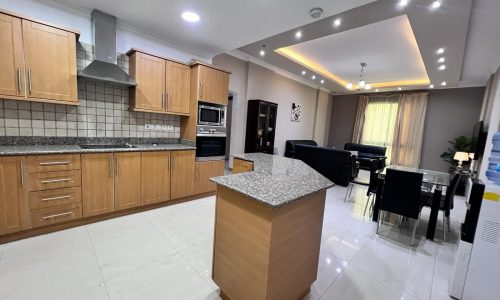 Tucked away in the vibrant neighborhood of Juffair, this kitchen offers an elevated living experience. Complete with a sleek table and comfortable chairs, it is the perfect space to gather for meals and