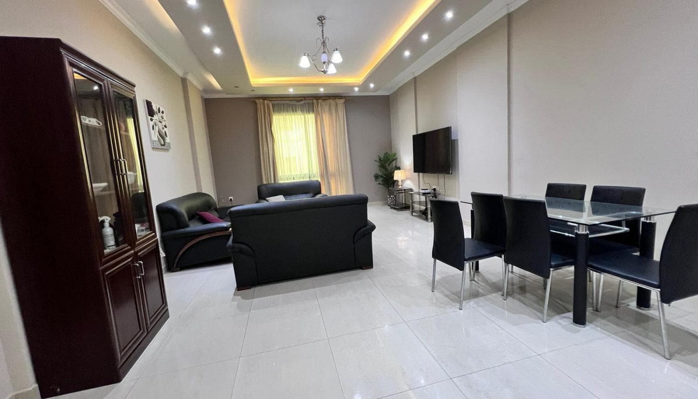 An elevated living experience with a room furnished with a table and chairs.