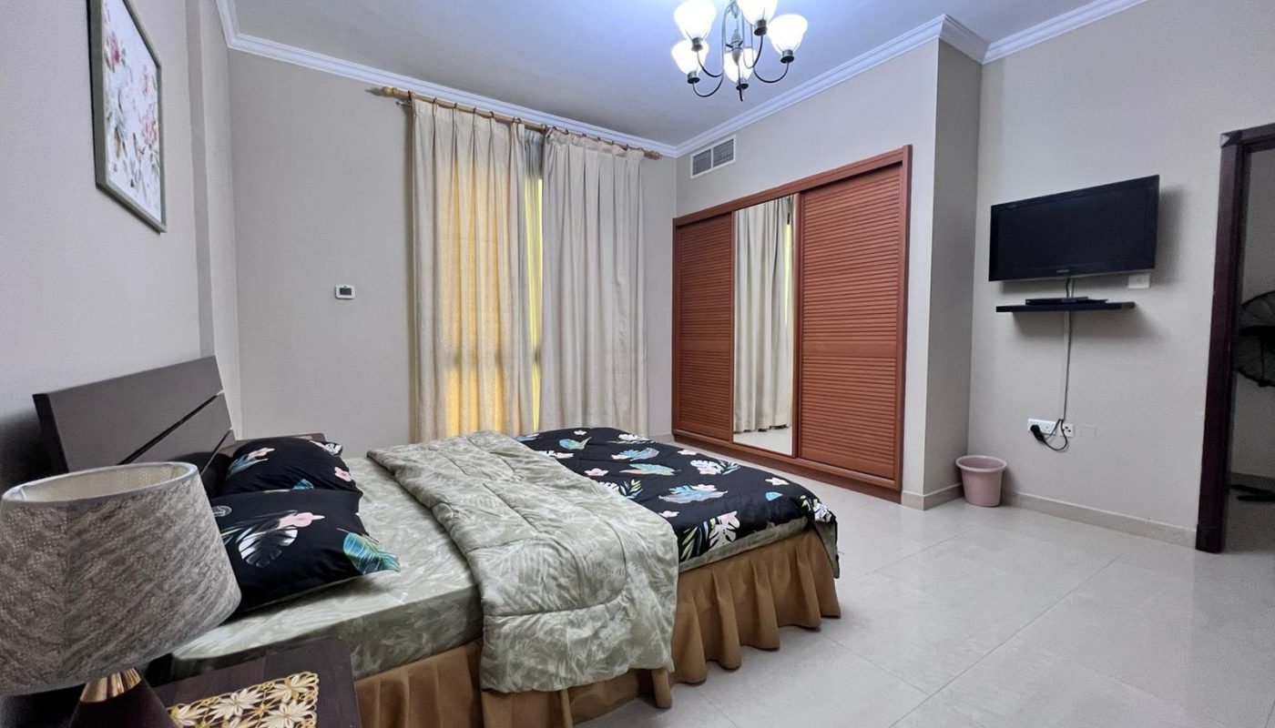 A dream home with an elevated living experience, featuring a bedroom equipped with a luxurious bed and a modern television.