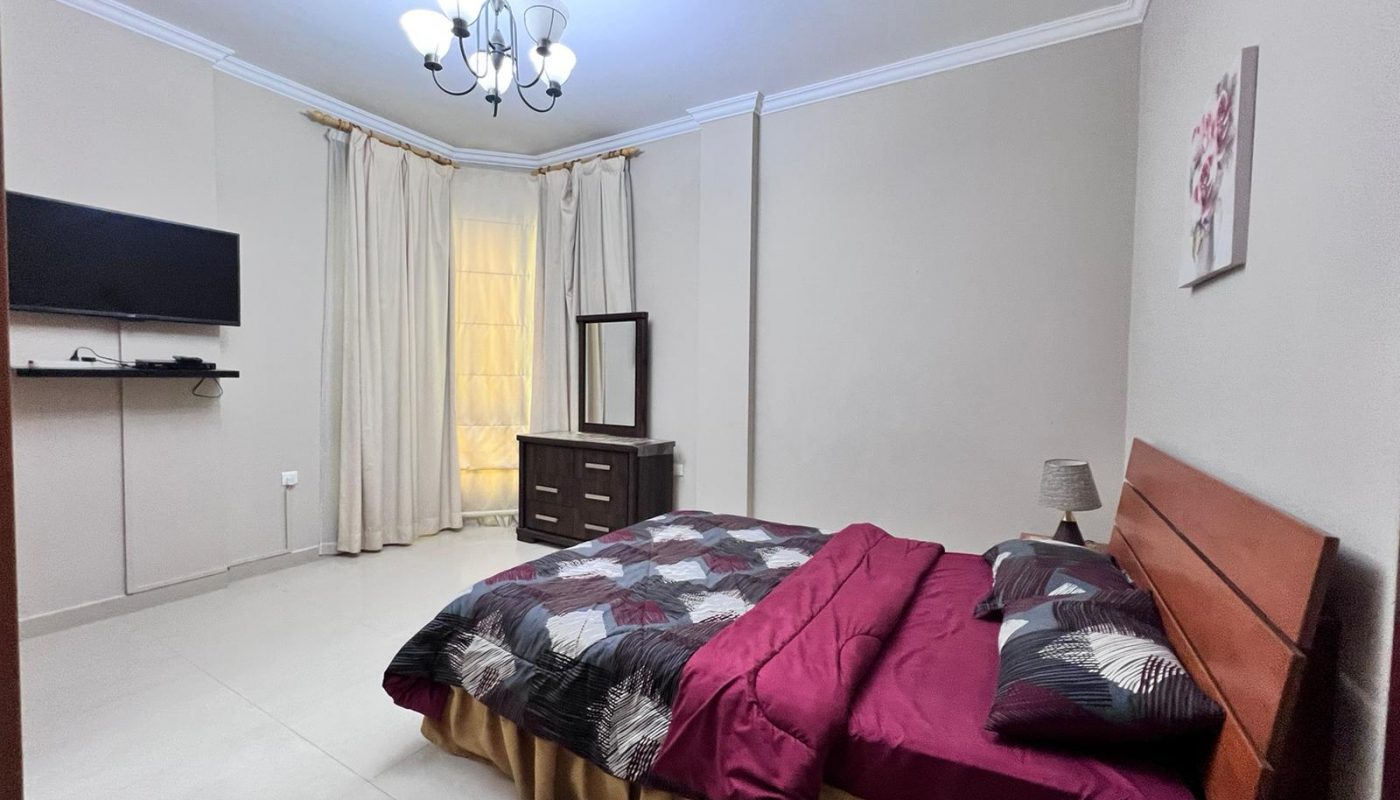 Elevate your living experience in this dream home, complete with a cozy bedroom featuring a luxurious bed and a state-of-the-art television.