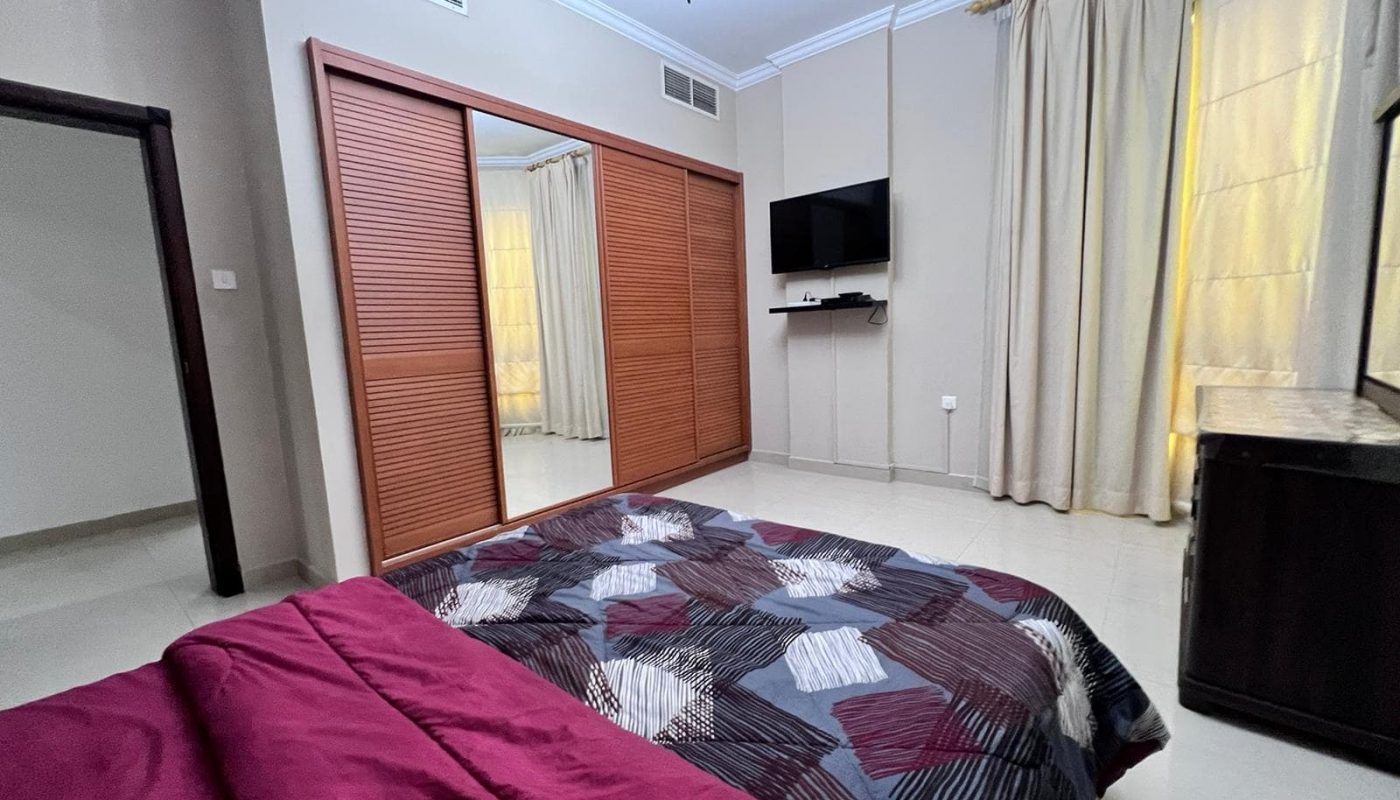 A dream home with a comfortable bed and a high-definition TV, offering an exquisite living experience in a 2-bedroom layout.