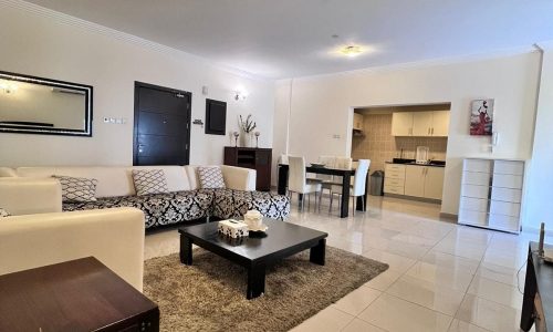 An Auto Draft living room with white furniture and a coffee table.