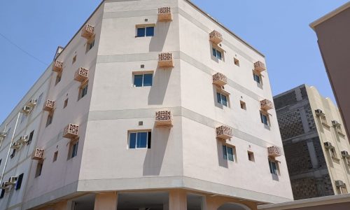 An auto-draft building with balconies on the side.