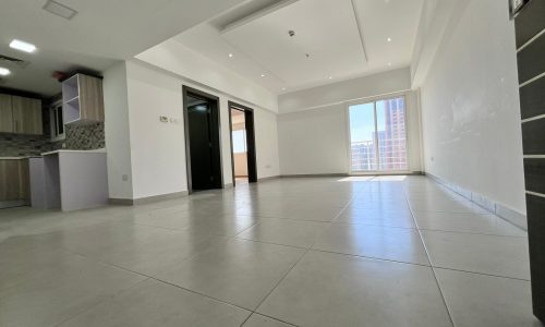 A Juffair apartment with tile floors and a view of the city, available for sale.