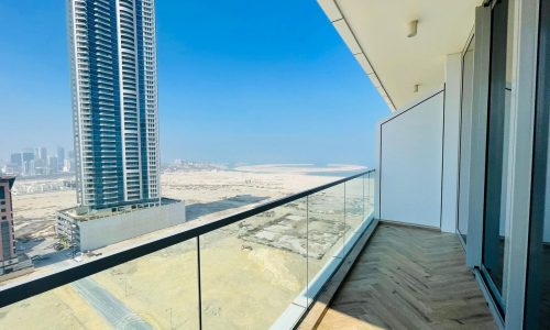 A balcony with a view of the city and skyscrapers.