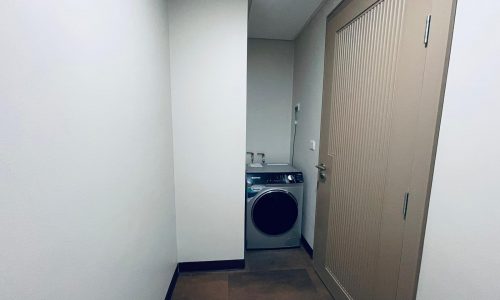 A laundry room with an Auto Draft washer and dryer in it.